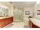 Elegant bathroom with a large walk-in shower, soaking tub, and double vanity at 7830 34Th W Ave # 102, Bradenton, FL 34209