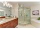 Spa-like bathroom with a large walk-in shower, soaking tub, and granite countertops at 7830 34Th W Ave # 102, Bradenton, FL 34209