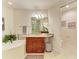 Bathroom with a soaking tub, granite countertop, and a separate vanity area at 7830 34Th W Ave # 102, Bradenton, FL 34209