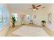 Spacious bedroom with a ceiling fan and large windows at 7830 34Th W Ave # 102, Bradenton, FL 34209