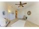 Bright bedroom with plush carpet, ceiling fan, and ample natural light at 7830 34Th W Ave # 102, Bradenton, FL 34209