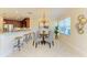 Elegant dining area with chandelier and stylish seating at 7830 34Th W Ave # 102, Bradenton, FL 34209