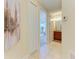 Hallway with light walls, tile flooring, and access to other rooms at 7830 34Th W Ave # 102, Bradenton, FL 34209