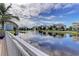 Scenic pond view with lush landscaping and fountain at 7830 34Th W Ave # 102, Bradenton, FL 34209