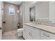 Clean bathroom with white cabinets, a large mirror, and a walk-in shower at 7940 Redonda Loop, Bradenton, FL 34202