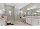 Spa-like bathroom with a large walk-in shower, double vanity, and modern fixtures at 7940 Redonda Loop, Bradenton, FL 34202