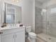 Clean bathroom with white vanity, toilet and a walk-in shower at 7940 Redonda Loop, Bradenton, FL 34202