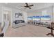 Multipurpose room with comfortable seating, large screen TVs, and built-in shelving at 7940 Redonda Loop, Bradenton, FL 34202