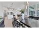 Open concept dining area with a view into the kitchen and access to natural light at 7940 Redonda Loop, Bradenton, FL 34202