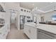Modern kitchen with white cabinets, quartz countertops and stainless steel appliances at 7940 Redonda Loop, Bradenton, FL 34202