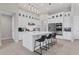 Modern kitchen with white cabinets, large island, and stainless steel appliances at 7940 Redonda Loop, Bradenton, FL 34202