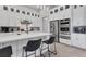 Modern kitchen boasts white cabinets, stainless steel appliances, and quartz countertops at 7940 Redonda Loop, Bradenton, FL 34202