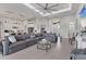 Bright and airy living room with a large sectional sofa and kitchen views at 7940 Redonda Loop, Bradenton, FL 34202