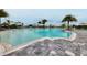 Resort-style pool with palm trees and lounge chairs at 7940 Redonda Loop, Bradenton, FL 34202