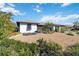 Attractive front yard with gravel landscaping and tropical plants at 9025 Hilolo Ln, Venice, FL 34293