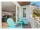 Balcony with teal chairs and sliding glass doors leading to living area at 106 7Th S St, Bradenton Beach, FL 34217
