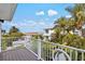 Balcony with ocean views and white railing at 106 7Th S St, Bradenton Beach, FL 34217