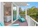Private balcony with teal chairs and tropical views at 106 7Th S St, Bradenton Beach, FL 34217