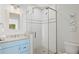 Bathroom with light blue vanity and walk-in shower at 106 7Th S St, Bradenton Beach, FL 34217