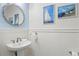 Charming powder room with nautical-themed decor at 106 7Th S St, Bradenton Beach, FL 34217