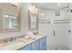 Bathroom with double vanity and walk-in shower at 106 7Th S St, Bradenton Beach, FL 34217