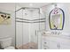 Spa-like bathroom with a walk-in shower, mosaic tile, and nautical accents at 106 7Th S St, Bradenton Beach, FL 34217