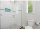 Clean bathroom with a walk-in shower and white tile at 106 7Th S St, Bradenton Beach, FL 34217