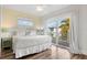 Main bedroom with king-size bed and sliding doors to balcony at 106 7Th S St, Bradenton Beach, FL 34217