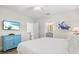 Bedroom with large bed, TV, and ensuite bathroom access at 106 7Th S St, Bradenton Beach, FL 34217