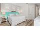 Spacious bedroom with a king-size bed and light teal headboard at 106 7Th S St, Bradenton Beach, FL 34217