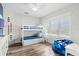 bedroom with a bunk bed, window, and hardwood floors at 106 7Th S St, Bradenton Beach, FL 34217