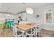 Bright dining area with a large wooden table and white chairs at 106 7Th S St, Bradenton Beach, FL 34217
