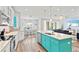 Open concept kitchen with island, stainless steel appliances, and white cabinetry at 106 7Th S St, Bradenton Beach, FL 34217