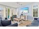 Living room with blue sofas and a large TV at 106 7Th S St, Bradenton Beach, FL 34217