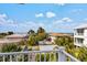 Balcony view overlooking the ocean and neighborhood homes at 106 7Th S St, Bradenton Beach, FL 34217