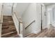 Modern staircase with wood and white railing at 106 7Th S St, Bradenton Beach, FL 34217