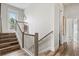 Staircase with wood and white railings leading to upper level at 106 7Th S St, Bradenton Beach, FL 34217