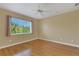 Bright bedroom with wood floors and large window offering natural light at 11546 52Nd E Ct, Parrish, FL 34219