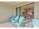 Private balcony with patio furniture and view of living area at 13816 Messina Loop # 203, Bradenton, FL 34211