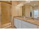 Double sink bathroom with a large shower at 13816 Messina Loop # 203, Bradenton, FL 34211