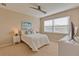 Bright bedroom with a queen bed and window blinds at 13816 Messina Loop # 203, Bradenton, FL 34211