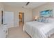 Spacious bedroom with a queen-size bed and en-suite bathroom at 13816 Messina Loop # 203, Bradenton, FL 34211