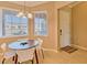 Breakfast nook with a round table and four chairs near the front entrance at 13816 Messina Loop # 203, Bradenton, FL 34211