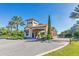 Gated entrance to a community with palm trees and landscaping at 13816 Messina Loop # 203, Bradenton, FL 34211