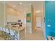 L-shaped kitchen island with granite countertops and white cabinets at 13816 Messina Loop # 203, Bradenton, FL 34211