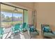 Relaxing sitting area with balcony access overlooking golf course at 13816 Messina Loop # 203, Bradenton, FL 34211