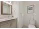 Modern bathroom with a vanity, toilet, and updated fixtures at 1703 N Tamiami Trl # 210, Sarasota, FL 34234