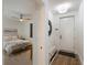 Comfortable bedroom with wood flooring and ceiling fan at 1703 N Tamiami Trl # 210, Sarasota, FL 34234