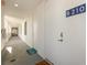 Building hallway with doors to individual units at 1703 N Tamiami Trl # 210, Sarasota, FL 34234