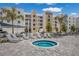 Relaxing hot tub area with lounge chairs for sunbathing at 1703 N Tamiami Trl # 210, Sarasota, FL 34234
